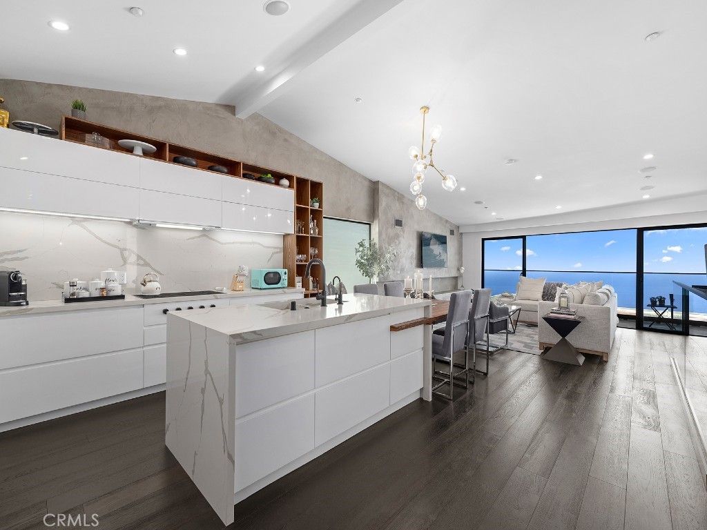 A brand-new designer kitchen shines with quartz countertops, white high-gloss cabinetry with Blum soft-close hardware, a - 1147 Miramar Street, Laguna Beach CA 92651 - photo 1