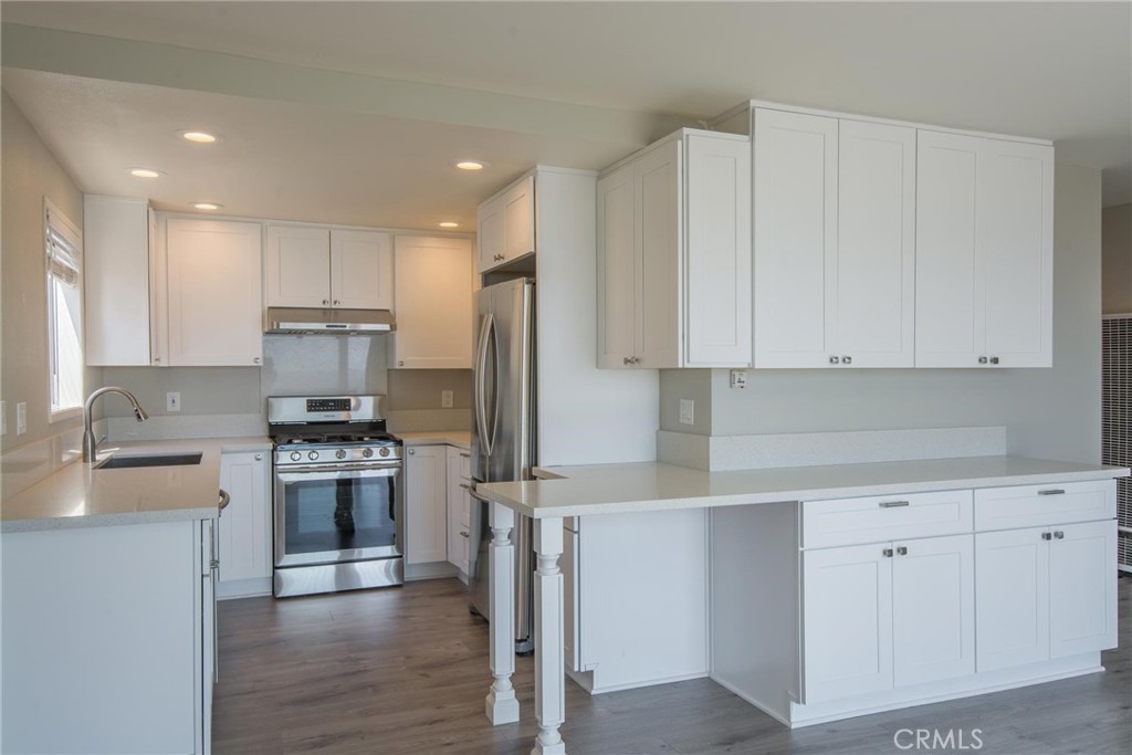 Kitchen with stainless appliances and gas stove - 1166 Gaviota Drive D, Laguna Beach CA 92651 - photo 3
