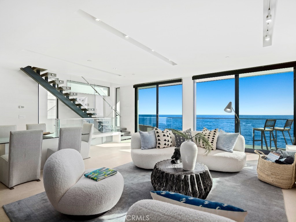 This stunning oceanfront Modern enjoys a coveted spot on the pristine sands of Brooks Street. - 1235 Ocean Front, Laguna Beach CA 92651 - photo 1