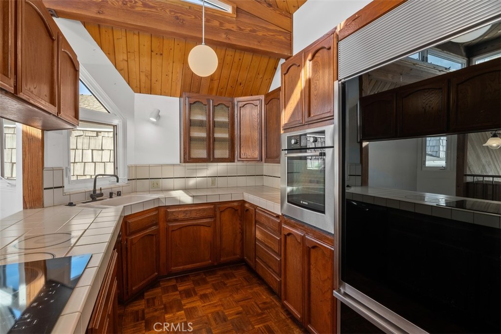 Galley kitchen with parquet flooring - 1325 La Mirada Street, Laguna Beach CA 92651 - photo 18