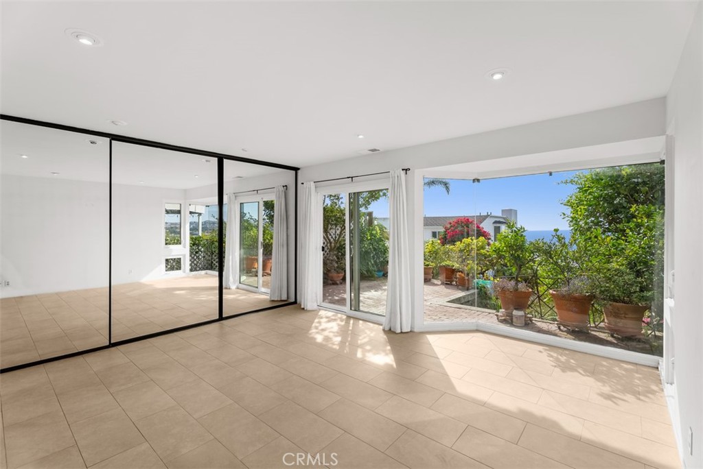 Lower level bedroom with a wall of glass - 1325 La Mirada Street, Laguna Beach CA 92651 - photo 22