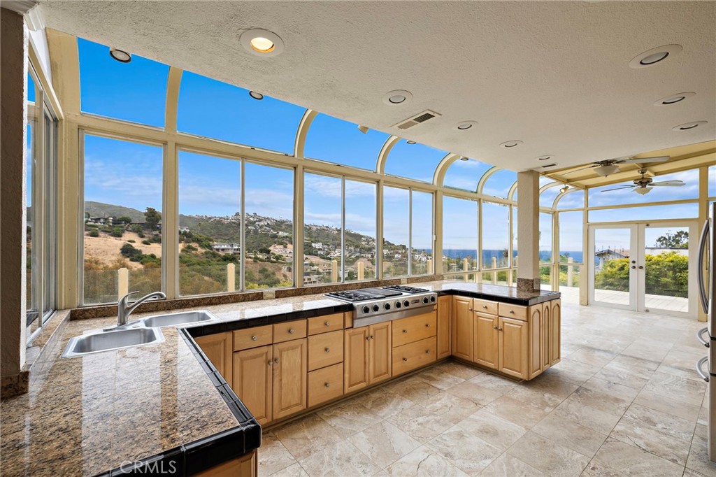 The expanded kitchen and sunroom area were thoughtfully designed to take full advantage of the spectacular views - 1337 Terrace Way, Laguna Beach CA 92651 - photo 7
