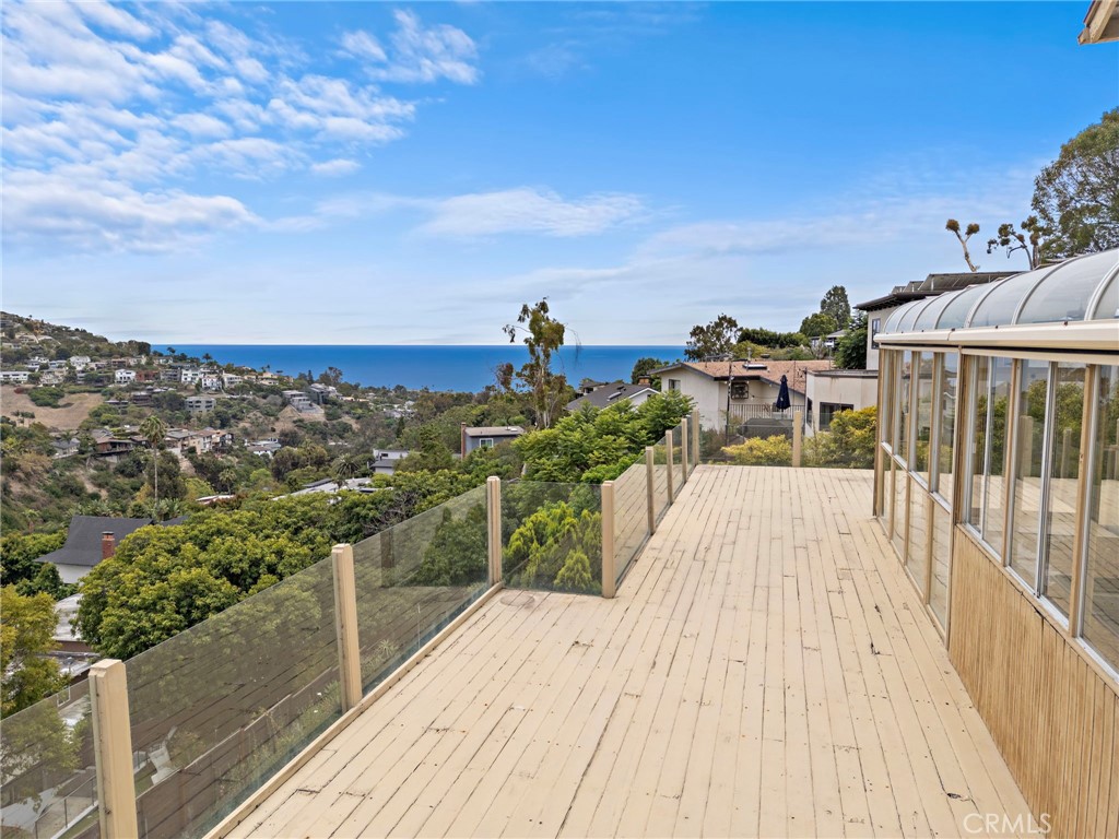 The expansive deck offers the perfect setting for entertaining against the stunning coastal backdrop. - 1337 Terrace Way, Laguna Beach CA 92651 - photo 10