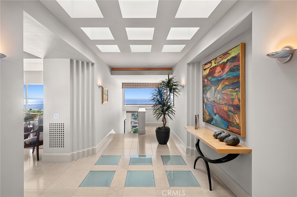 Encompassing approximately 5,603 square feet, the four-bedroom, four-and-one-half-bath home is thoughtfully designed to - 1409 Samoa Way, Laguna Beach CA 92651 - photo 7
