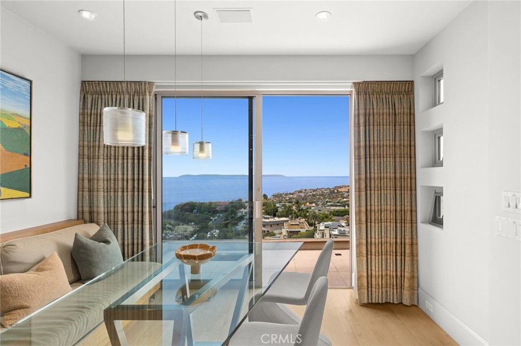 With breathtaking ocean and whitewater views extending to the dining area showcasing an inspiring setting for morning co - 1409 Samoa Way, Laguna Beach CA 92651 - photo 11