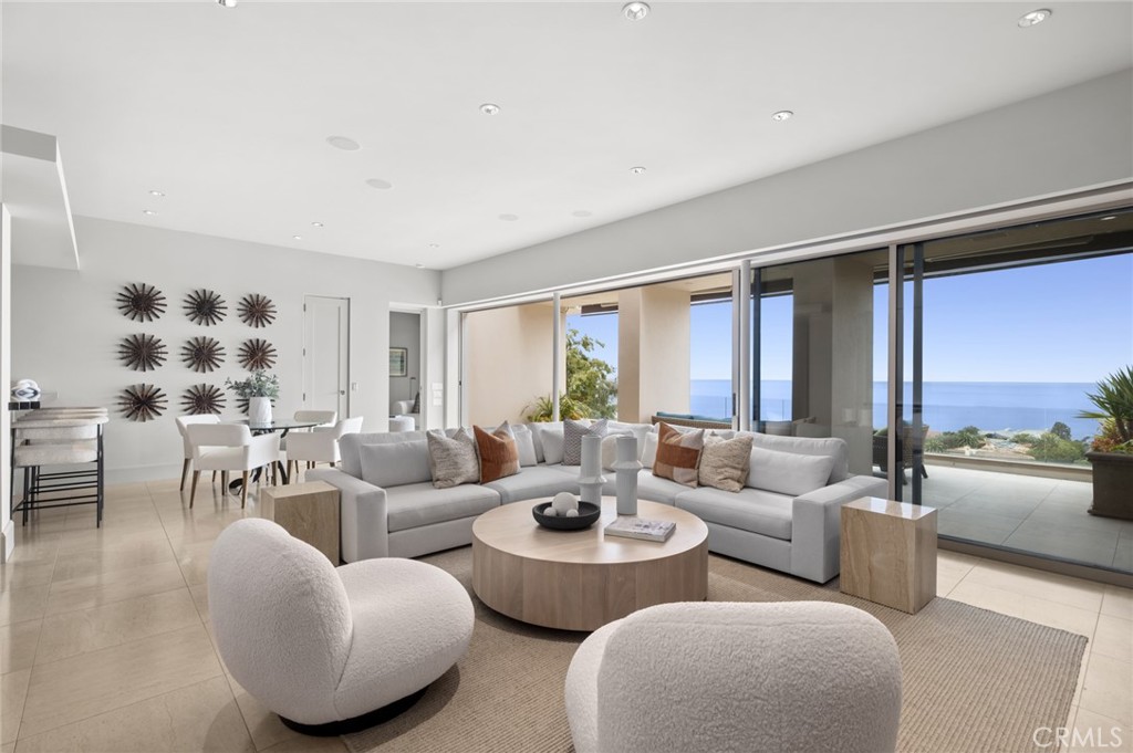 Generously sized decking off a secondary grand living room with a bar area extends the living spaces and includes an out - 1409 Samoa Way, Laguna Beach CA 92651 - photo 25