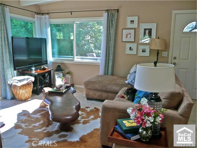View of the living room as previously furnished by past tenant. Home is leased unfurnished - 1435 Bluebird Canyon Drive, Laguna Beach CA 92651 - photo 1