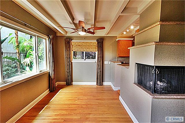 Another view of the double sided fireplace & dining room - 146 CLIFF Drive C, Laguna Beach CA 92651 - photo 1