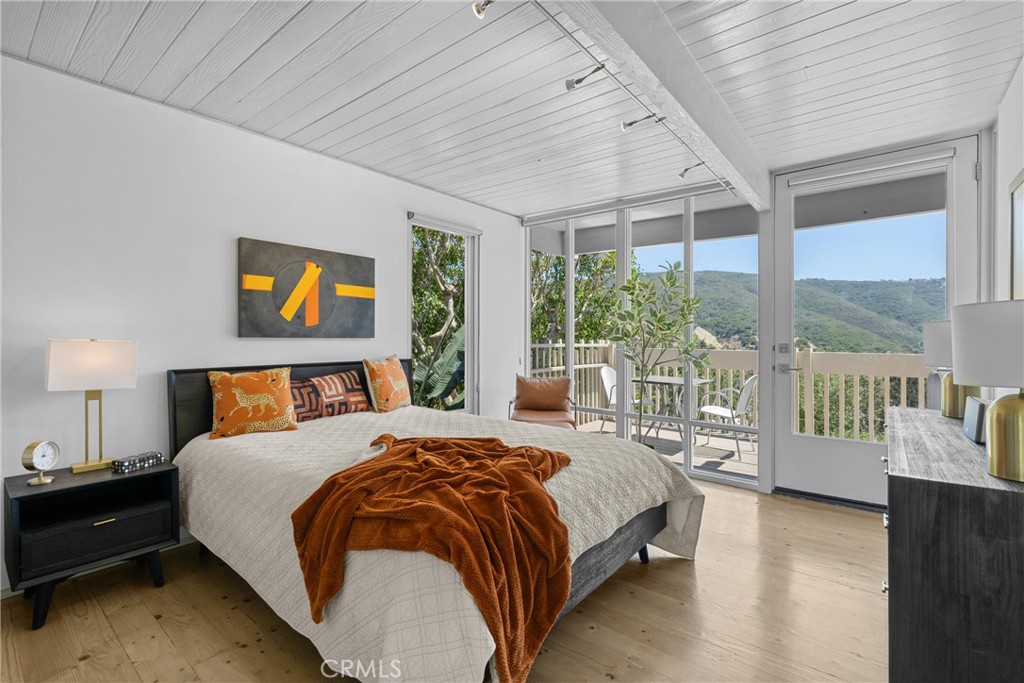 bedroom with access to upper level deck - 1494 Bluebird Canyon Drive, Laguna Beach CA 92651 - photo 28