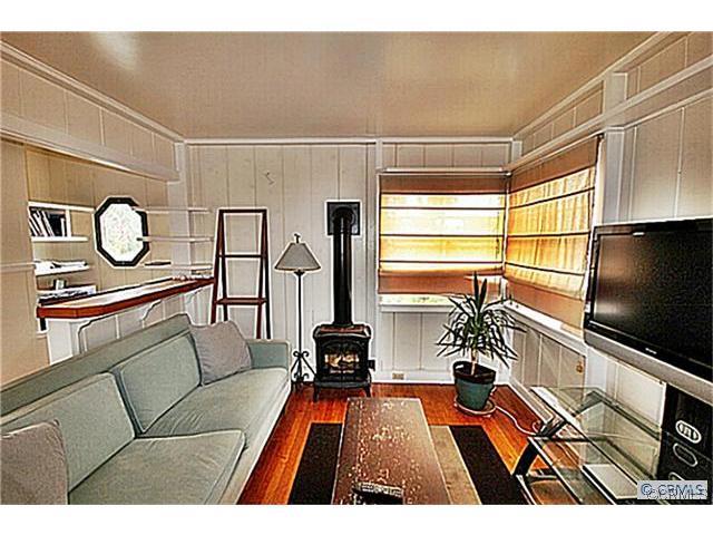 Living area features hardwood floors, fireplace heater, breakfast bar area~ - 1520 Glenneyre Street A, Laguna Beach CA 92651 - photo 1