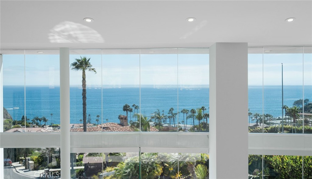 Walls of glass showcasing the sparkling Pacific Ocean views. - 155 Irvine Cove Place, Laguna Beach CA 92651 - photo 1