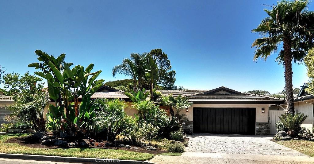 Gorgeous Crown Point home with new plastered exterior and custom stacked stone. Custom lighting and landscaping. - 156 Mcknight Drive, Laguna Beach CA 92651 - photo 1