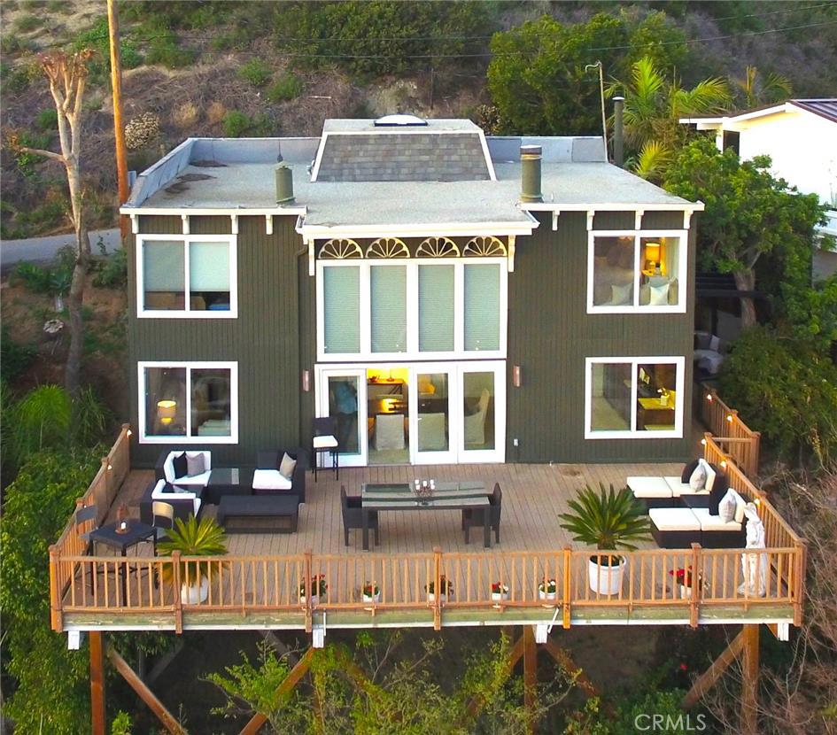 Aerial shot of this stunning Bluebird Canyon home with a 795 sq ft ocean view deck! - 1585 Bluebird Canyon Drive, Laguna Beach CA 92651 - photo 1