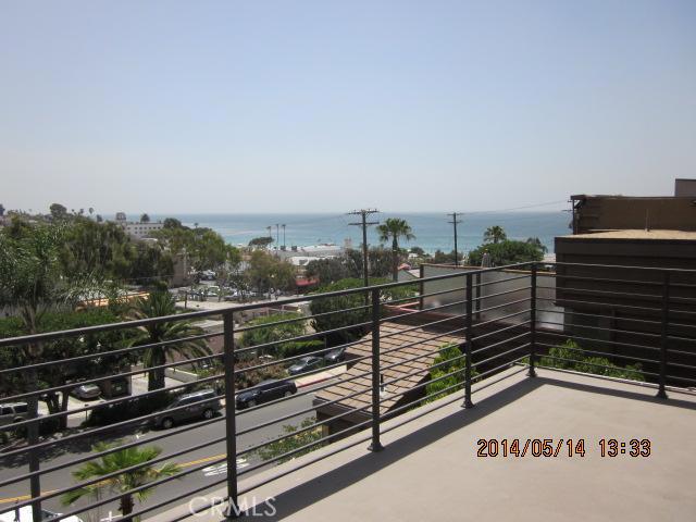 Great panoramic views of City, hills & ocean from the huge private deck - 160 F Cedar Way F, Laguna Beach CA 92651 - photo 1
