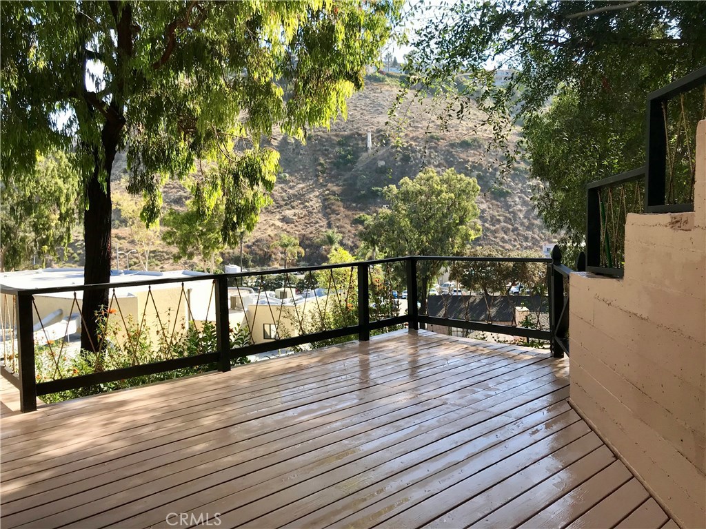 Large wrap around deck under a canopy of trees. Canyon views - 160 High Drive C, Laguna Beach CA 92651 - photo 1