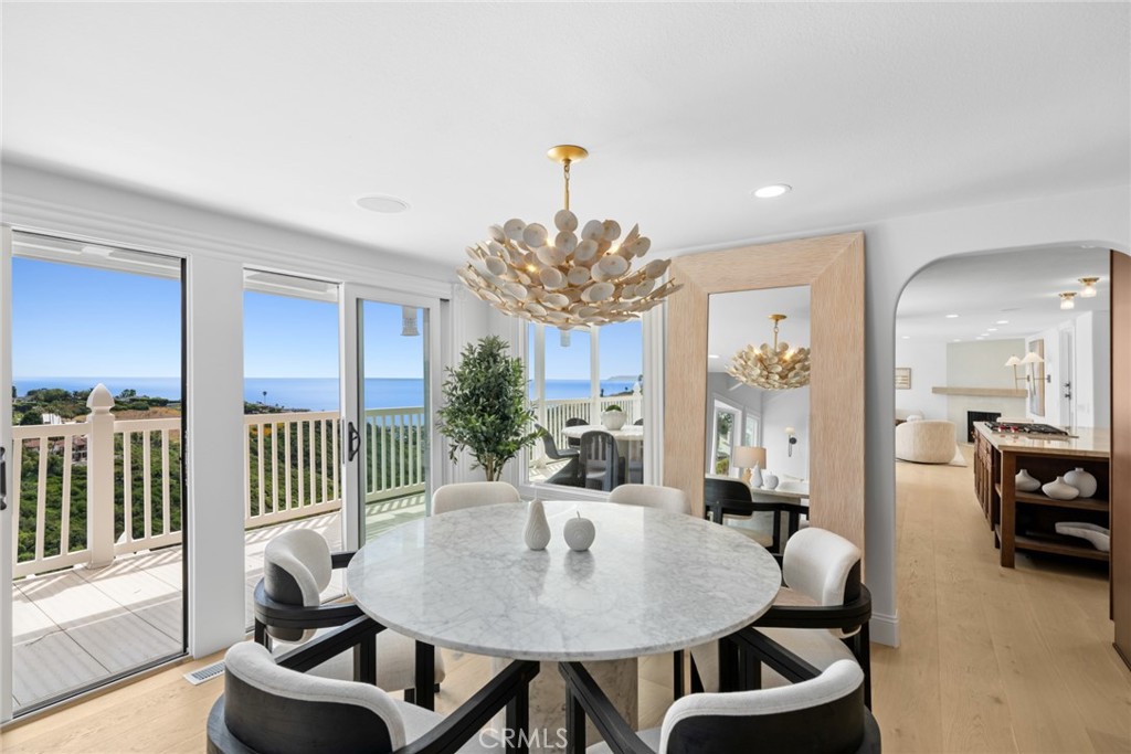 Spanning approximately 3,843 square feet on an expansive 30,320-square-foot lot, the home offers five bedrooms plus an o - 1675 Tahiti Avenue, Laguna Beach CA 92651 - photo 3