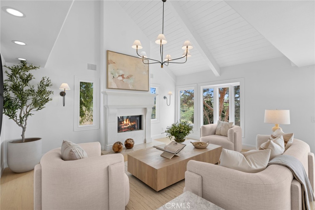 Natural light fills the main living areas through large picture windows and multiple sliding glass doors, creating a sea - 1675 Tahiti Avenue, Laguna Beach CA 92651 - photo 8