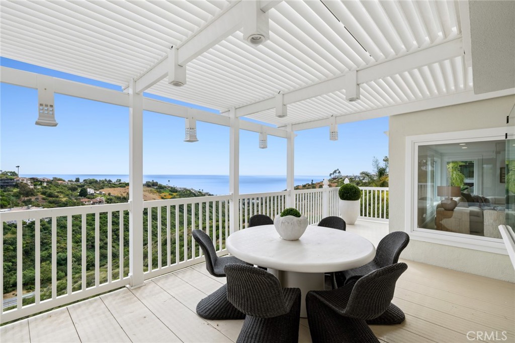 From the moment you enter, unobstructed panoramic views unfold stretching from the rolling hills of Laguna Beach to the - 1675 Tahiti Avenue, Laguna Beach CA 92651 - photo 11