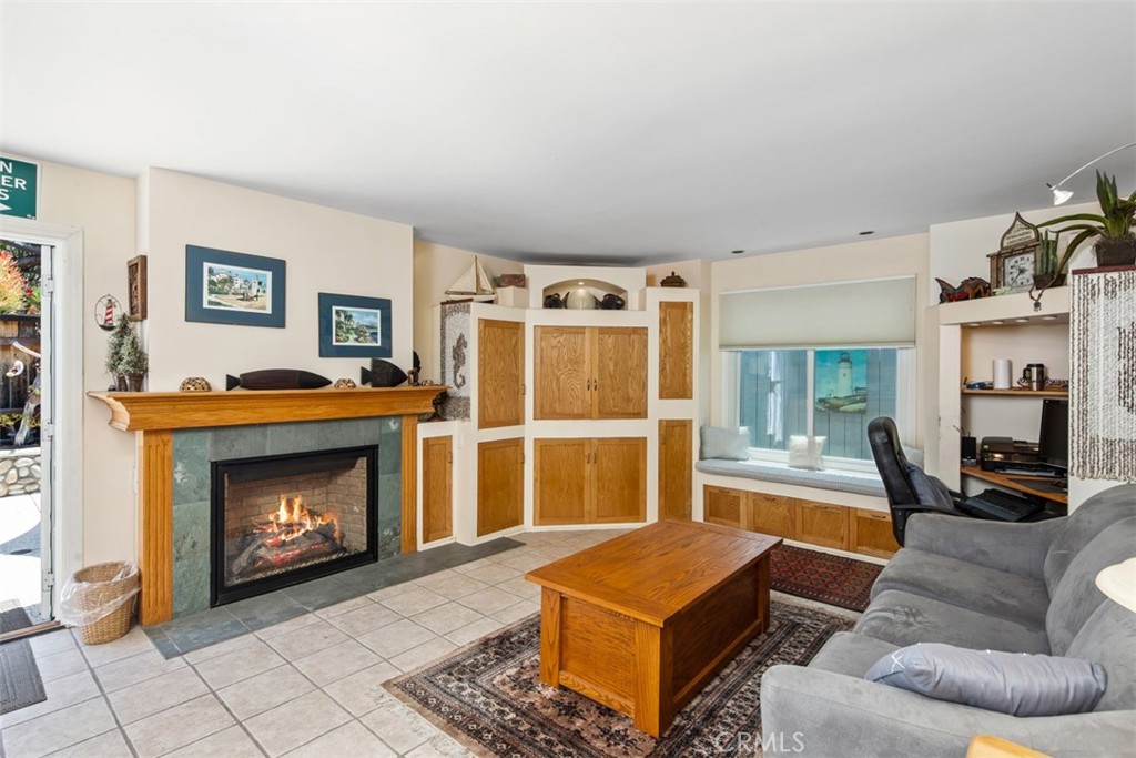 Family Room with Tile Floors and Fireaplce. Open to Backyard - 181 SUNSET Terrace, Laguna Beach CA 92651 - photo 14