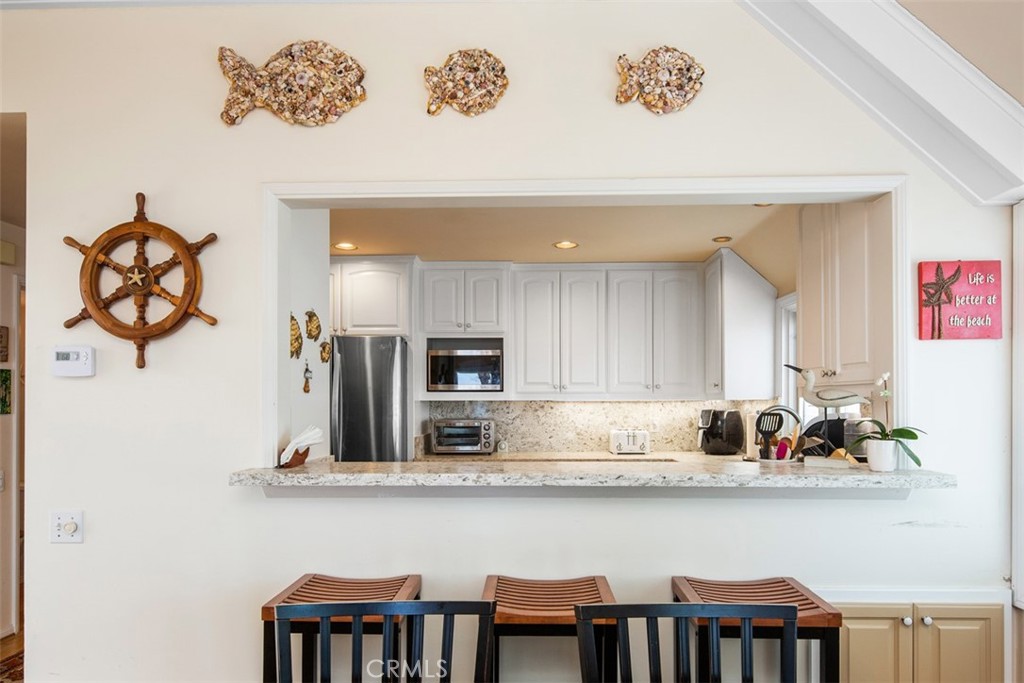 Countertop bar to Kitchen - 181 SUNSET Terrace, Laguna Beach CA 92651 - photo 45