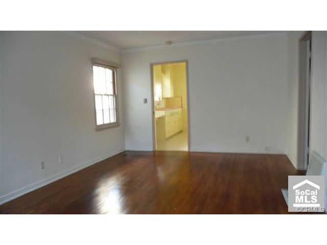 Beautiful hardwood floors throughout main living area and bedroom~ Floor furnace, in living room and inviting front porc - 187 Lower Cliff Drive, Laguna Beach CA 92651 - photo 1