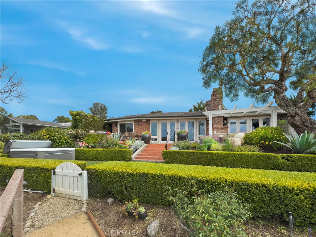 Rear view of home with expansive garden - 1888 Temple Hills Drive, Laguna Beach CA 92651 - photo 1