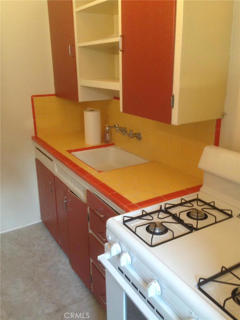 What a difference a day makes...new 30" stove, new flooring, new painted walls in kitchen - 209 Cypress Drive, Laguna Beach CA 92651 - photo 1