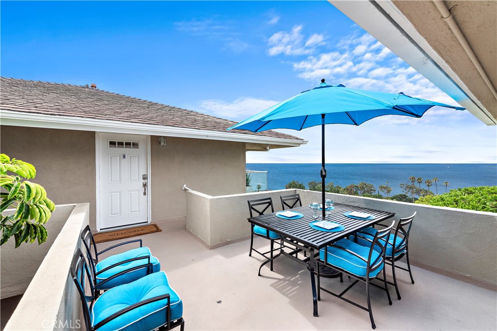 Front door and outdoor seating area. - 21682 Ocean Vista Drive D, Laguna Beach CA 92651 - photo 2