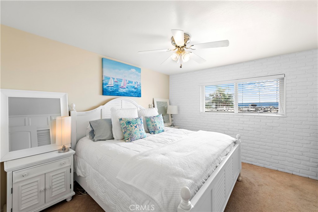 Master bedroom with window to the view. - 21682 Ocean Vista Drive D, Laguna Beach CA 92651 - photo 10