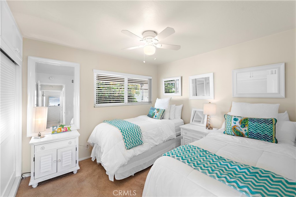 Second bedroom with sliding closet storage. - 21682 Ocean Vista Drive D, Laguna Beach CA 92651 - photo 13