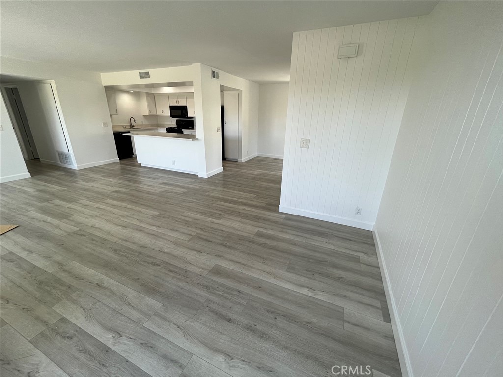 Living Room looking towards kitchen and dining room. - 217 Dolphin Way E, Laguna Beach CA 92651 - photo 11