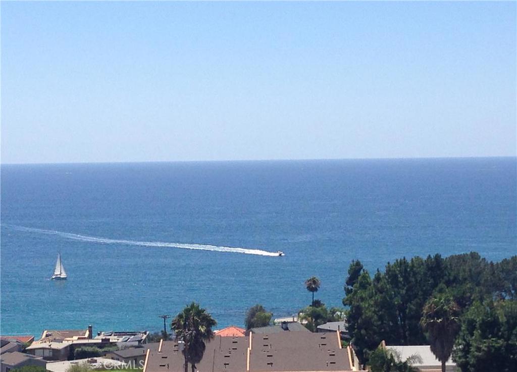 Enjoy viewing paddleboarders, kayakers, boats, sunset, and Catalina Island from the comfort of your front patio! - 21702 Ocean Vista Drive B, Laguna Beach CA 92651 - photo 1