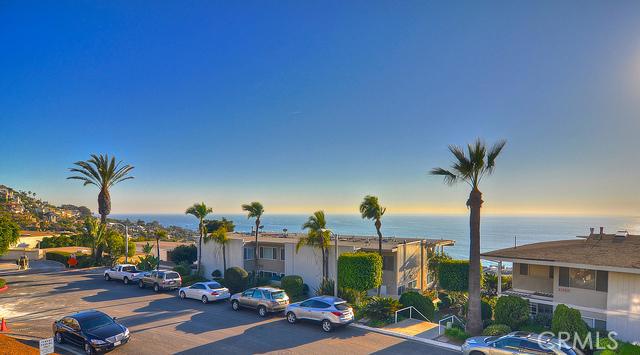 Panoramic ocean, sunset views to the south. - 21703 Ocean Vista Drive 203, Laguna Beach CA 92651 - photo 1