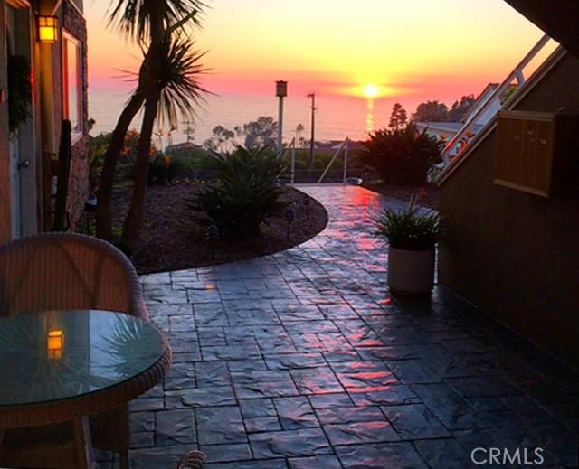 Sunset as seen from the front patio and entry of living room. - 21711 Wesley Drive B, Laguna Beach CA 92651 - photo 1