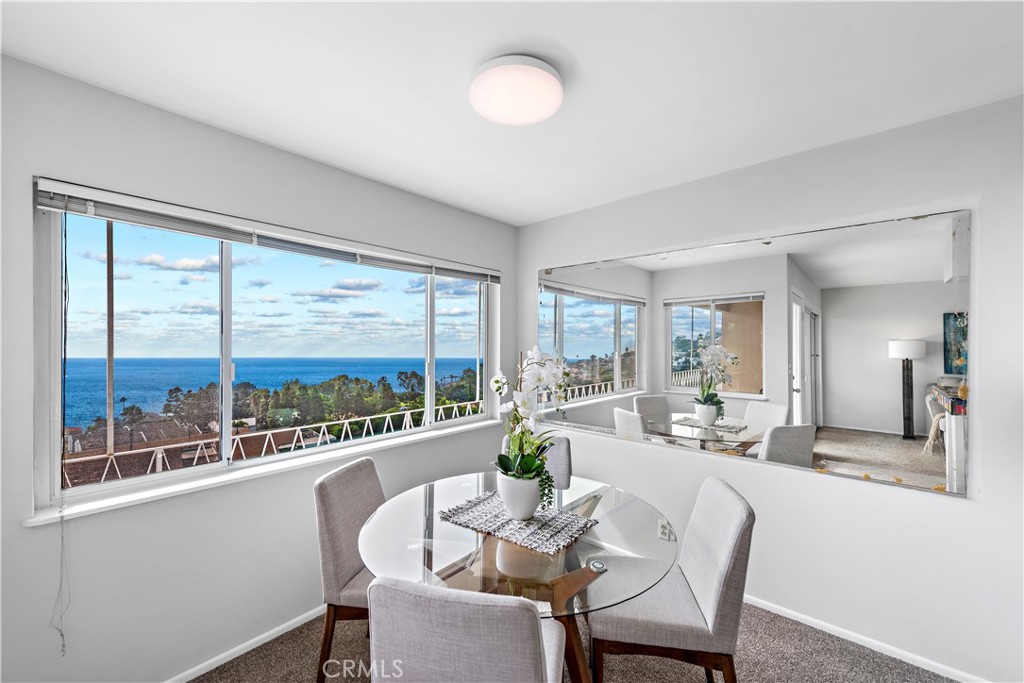 Dining area with ocean views. - 21722 Ocean Vista Drive F, Laguna Beach CA 92651 - photo 4