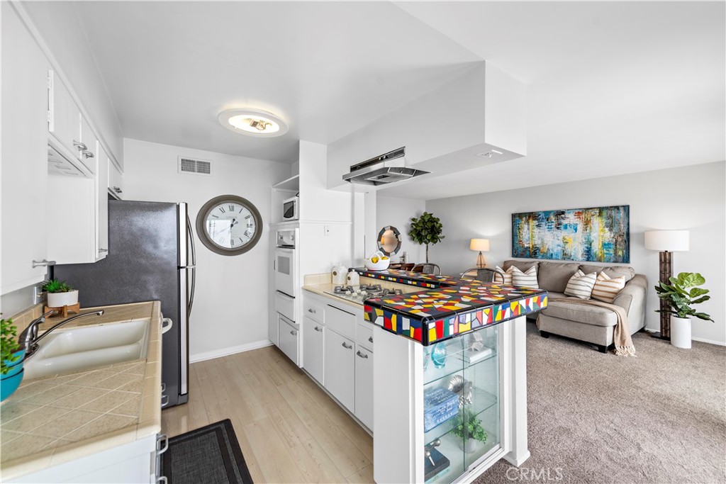 Another angle of kitchen. - 21722 Ocean Vista Drive F, Laguna Beach CA 92651 - photo 7