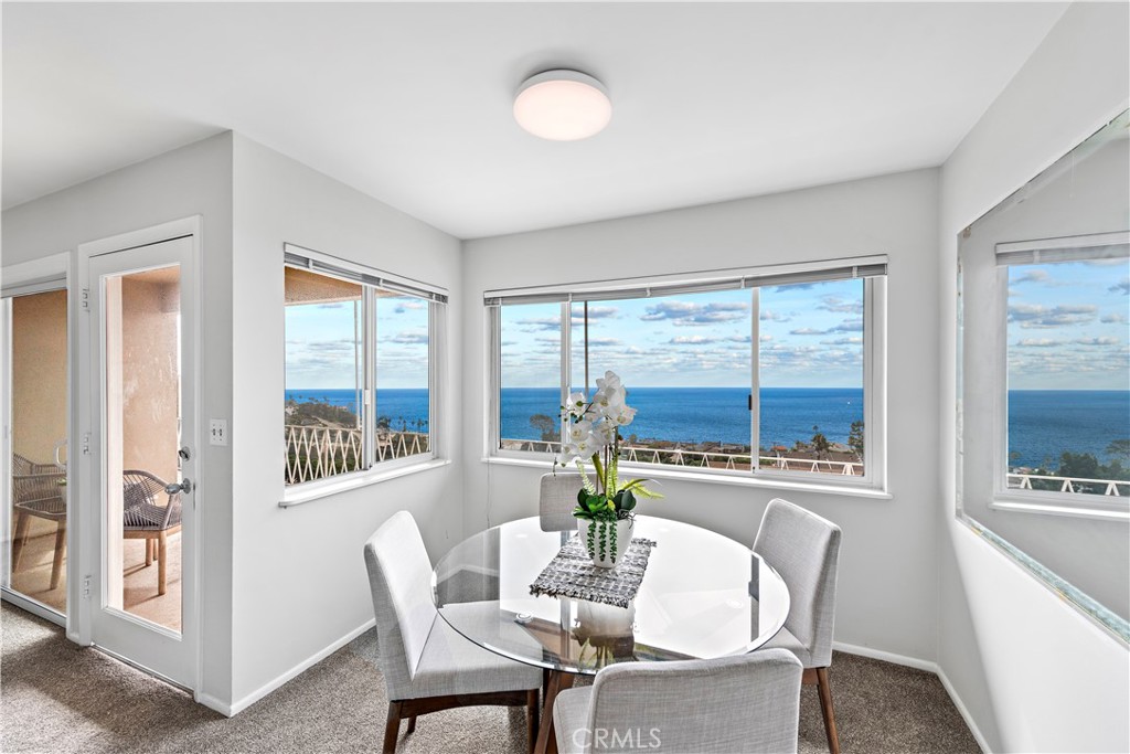Front door area as seen from the dining space. - 21722 Ocean Vista Drive F, Laguna Beach CA 92651 - photo 8