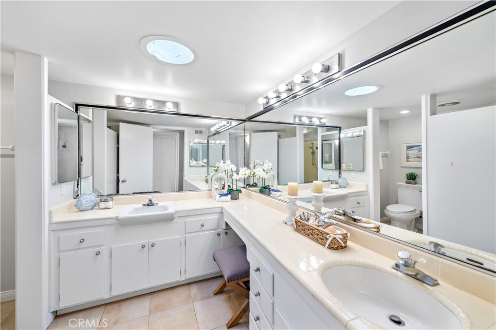 Bathroom with dual vanities. - 21722 Ocean Vista Drive F, Laguna Beach CA 92651 - photo 12