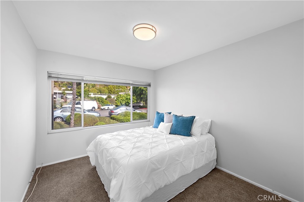 Second bedroom has walk in closet storage. - 21722 Ocean Vista Drive F, Laguna Beach CA 92651 - photo 14