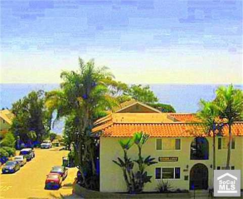 View of condo building from across PCH. Unit is located in upper left hand corner of bldg. - 2175 S COAST Highway 11, Laguna Beach CA 92651 - photo 1