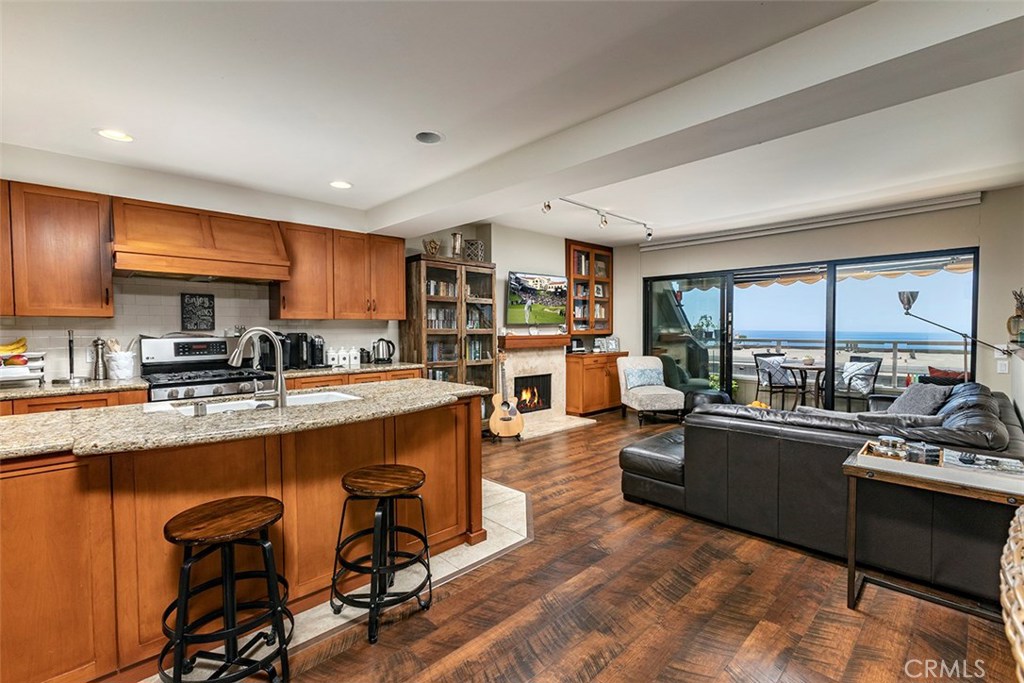 Remodeled open kitchen with the living room beyond. - 21771 Ocean Vista Drive 29, Laguna Beach CA 92651 - photo 1