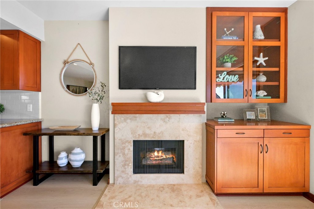 Newer gas fireplace & newer built-in cabinets. - 21771 Ocean Vista Drive 29, Laguna Beach CA 92651 - photo 3
