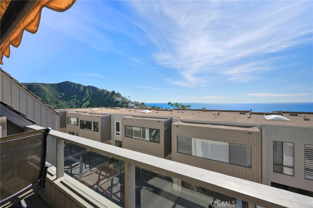Another view of the exterior deck and the ocean views beyond. - 21771 Ocean Vista Drive 29, Laguna Beach CA 92651 - photo 11