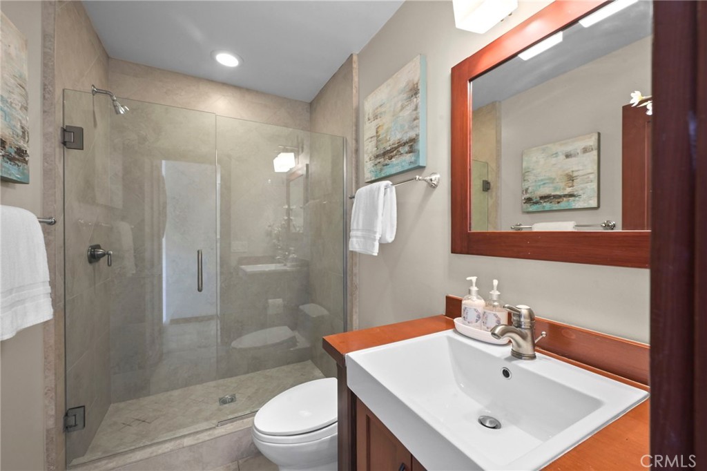 Remodeled bathroom, that was a 1/2 bath but now with a walk-in shower! - 21771 Ocean Vista Drive 29, Laguna Beach CA 92651 - photo 13