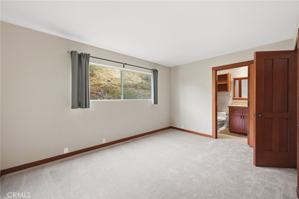 2nd en-suite bedroom with new carpeting. - 21771 Ocean Vista Drive 29, Laguna Beach CA 92651 - photo 24