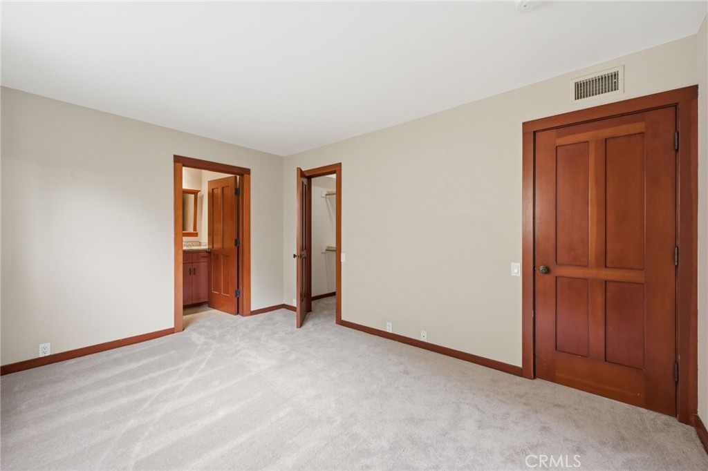 2nd bedroom with attached bath, walk-in closet and new carpeting. - 21771 Ocean Vista Drive 29, Laguna Beach CA 92651 - photo 25