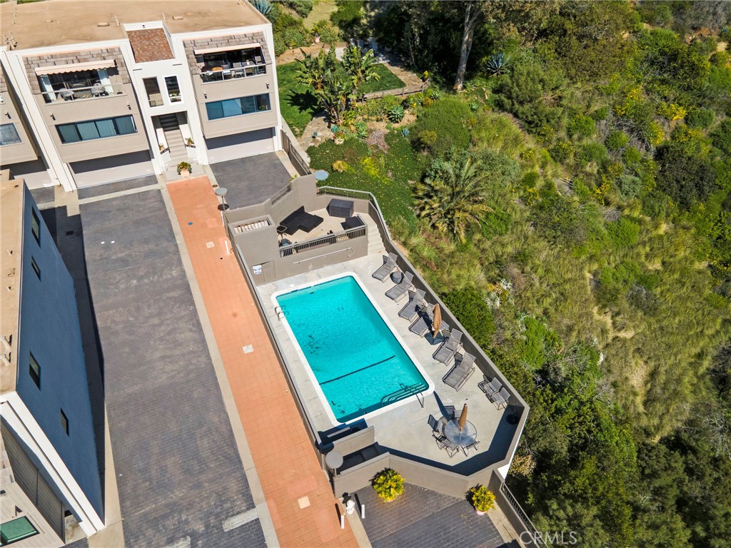 This is a drone shot of the community pool and the picnic park area just beyond. - 21771 Ocean Vista Drive 29, Laguna Beach CA 92651 - photo 35