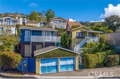 Two charming cottages on one lot with OCEAN VIEWS just steps to Victoria Beach and world renown restaurants! The local t - 223 & 217 Nyes Place, Laguna Beach CA 92651 - photo 1