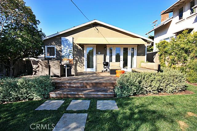 Backyard with lush landscaping and patio - 239 SAN JOAQUIN Street, Laguna Beach CA 92651 - photo 1