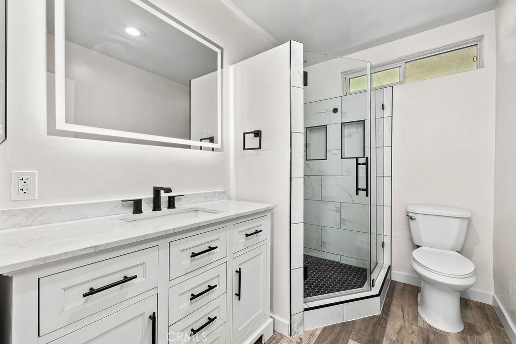 Remodeled primary suite bathroom with walk in shower - 240 Moss 2, Laguna Beach CA 92651 - photo 14